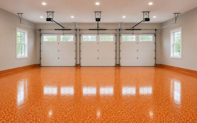 Orange flake epoxy floor in a three-car garage in Kingston